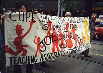 Union members holding a banner with red silhouettes of people. The banner text reads "CUPE 3903 ~ York University. Solidarity for Jobs & Justice. Teaching Assistants + Contract Faculty".