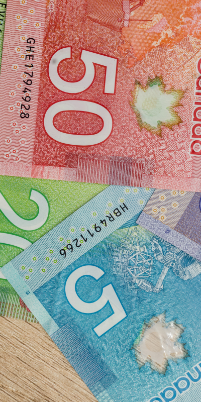 Close-ups of various Canadian dollar bills.